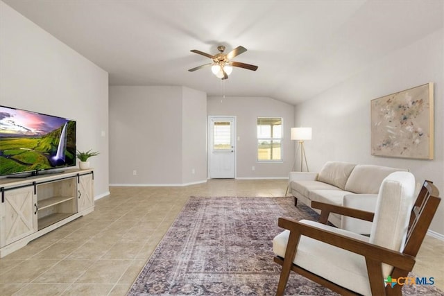 living room featuring ceiling fan and vaulted ceiling