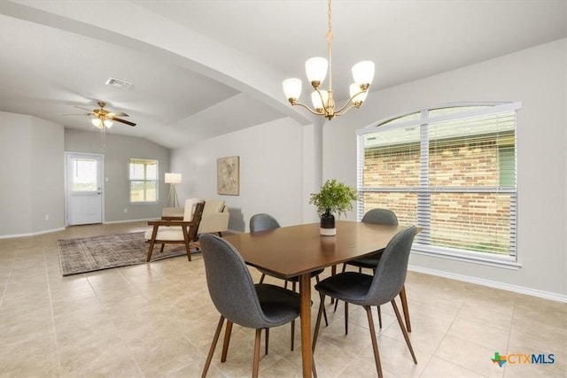 tiled dining area with ceiling fan with notable chandelier and vaulted ceiling