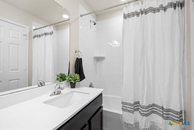 bathroom featuring vanity and shower / bathtub combination with curtain