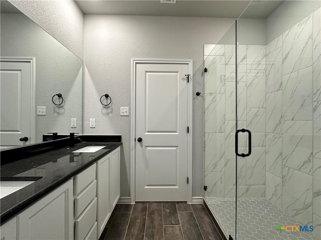 bathroom with vanity and an enclosed shower