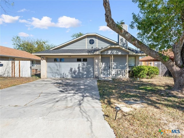 2109 Cimmaron Dr, Killeen, TX 76543 - ranch-style home with brick siding, driveway, an attached garage, and covered porch