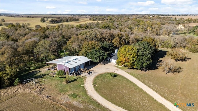 birds eye view of property with a rural view