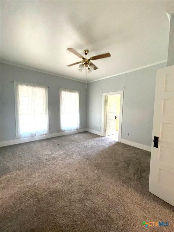 6268 Fm 2269, Buckholts, TX 76518 - empty room with carpet flooring, ceiling fan, and baseboards