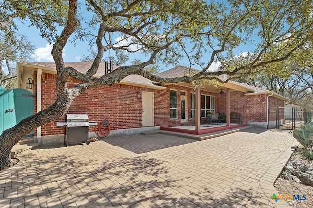 120 Oak Vis, New Braunfels, TX 78132 - back of house with brick siding, a gate, and fence