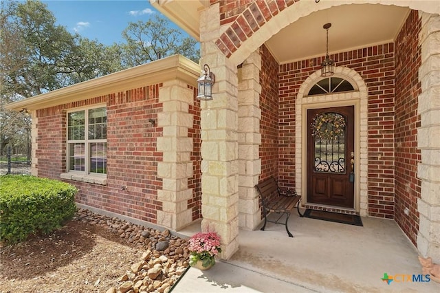 120 Oak Vis, New Braunfels, TX 78132 - doorway to property featuring brick siding