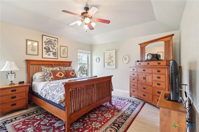 120 Oak Vis, New Braunfels, TX 78132 - bedroom with a tray ceiling, vaulted ceiling, light wood finished floors, baseboards, and ceiling fan