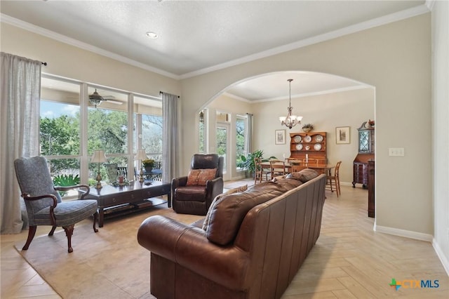 120 Oak Vis, New Braunfels, TX 78132 - living area with an inviting chandelier, arched walkways, crown molding, and baseboards