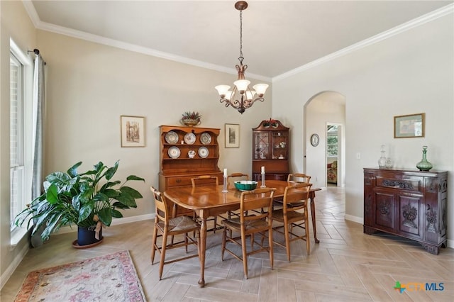 120 Oak Vis, New Braunfels, TX 78132 - dining room featuring arched walkways, baseboards, an inviting chandelier, and crown molding