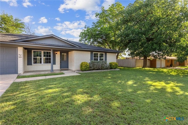 single story home with an attached garage, brick siding, a porch, and driveway
