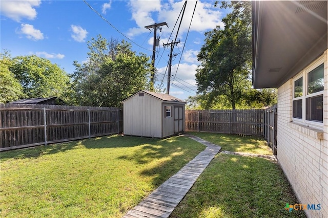 view of yard featuring a shed and an outdoor structure