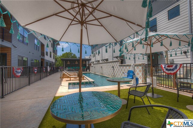 view of patio featuring a community pool