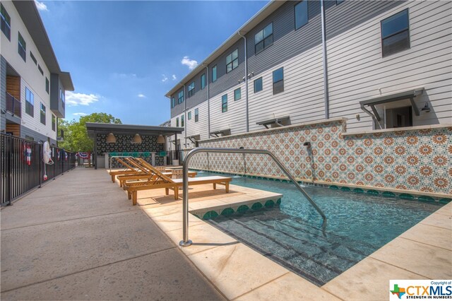 view of pool with a patio area