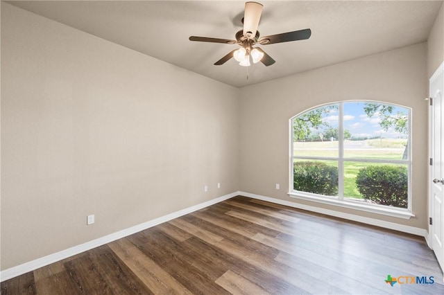 574 Rose Ln, Salado, TX 76571 - unfurnished room featuring dark wood-style flooring and a ceiling fan