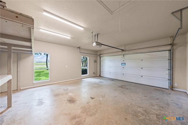 574 Rose Ln, Salado, TX 76571 - garage with a garage door opener and baseboards