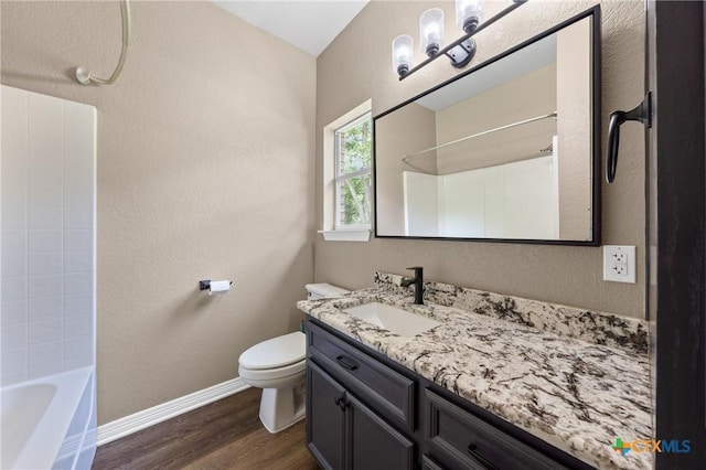 574 Rose Ln, Salado, TX 76571 - full bath featuring wood finished floors, vanity, and bathtub / shower combination