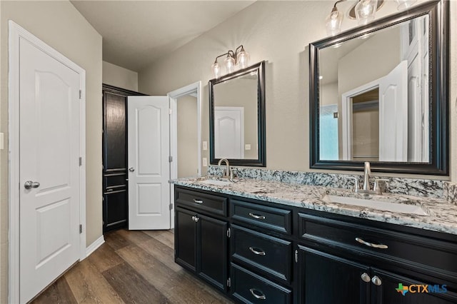 574 Rose Ln, Salado, TX 76571 - bathroom featuring wood finished floors and double vanity