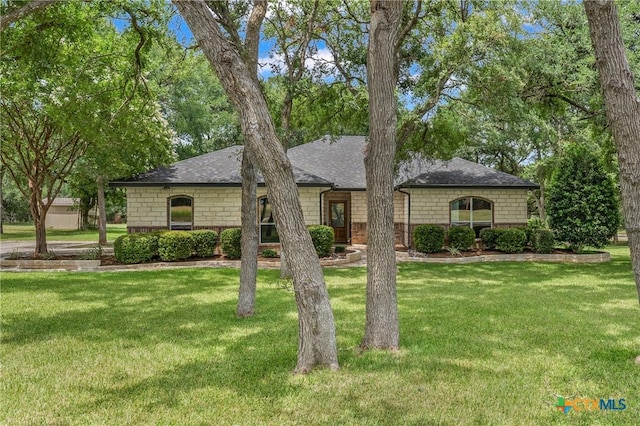 574 Rose Ln, Salado, TX 76571 - view of front facade with a front yard, roof with shingles, and stone siding
