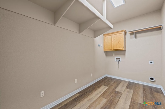 574 Rose Ln, Salado, TX 76571 - laundry room with cabinet space, dark wood-style floors, hookup for a washing machine, and electric dryer hookup