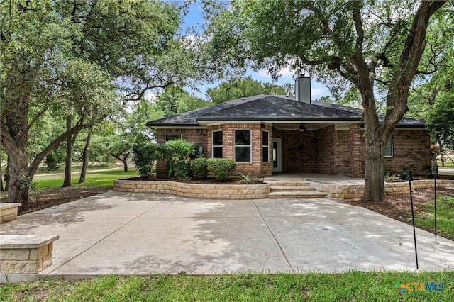 574 Rose Ln, Salado, TX 76571 - rear view of property featuring a ceiling fan, brick siding, and a patio area