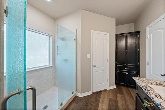 574 Rose Ln, Salado, TX 76571 - full bathroom with wood finished floors, a stall shower, and vanity