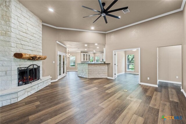 574 Rose Ln, Salado, TX 76571 - unfurnished living room with a brick fireplace, ceiling fan, ornamental molding, dark wood finished floors, and recessed lighting