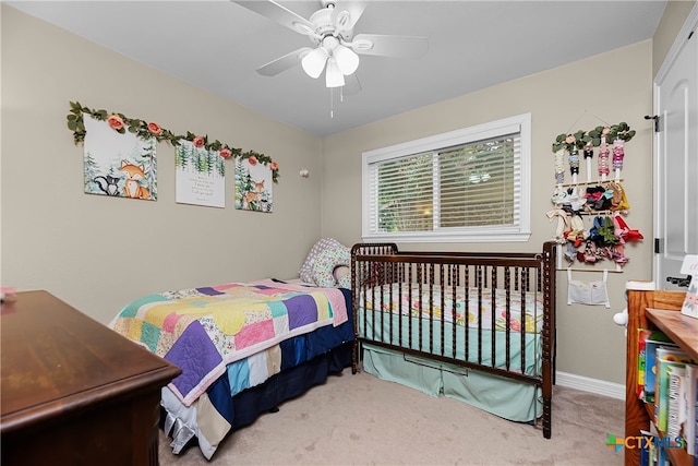 carpeted bedroom featuring ceiling fan