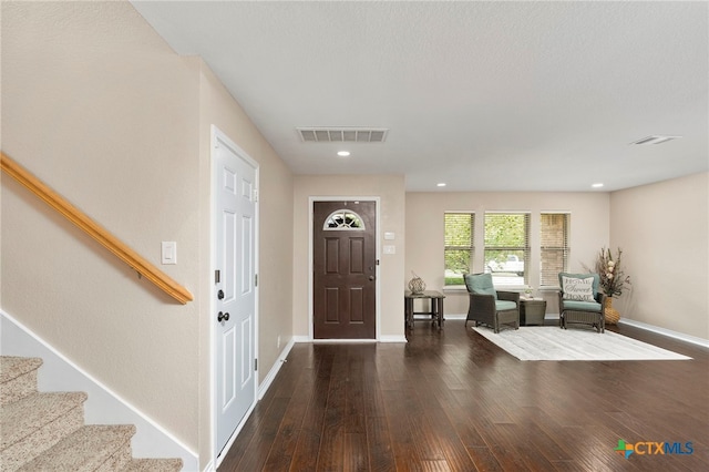 entrance foyer with dark hardwood / wood-style floors