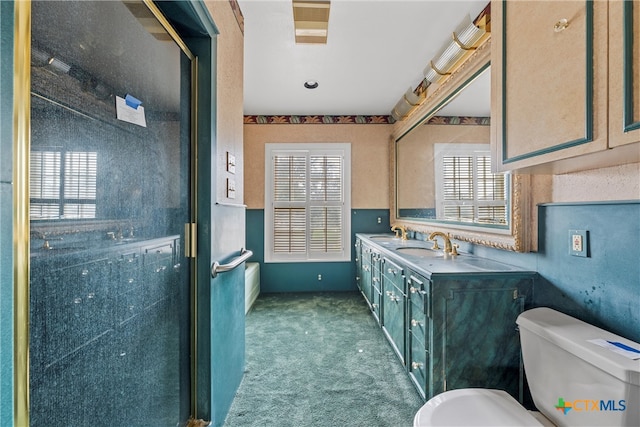 bathroom featuring toilet and vanity