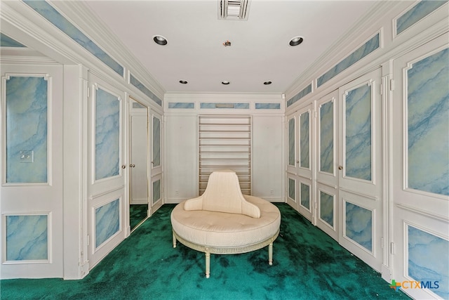 living area featuring ornamental molding and dark colored carpet