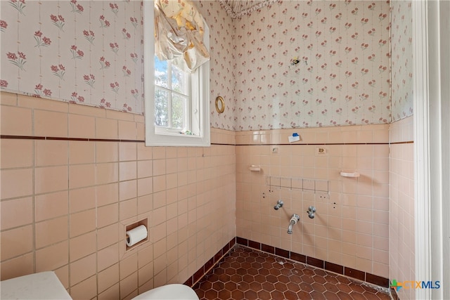 bathroom featuring tile walls and tile patterned flooring