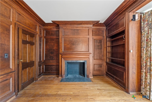 unfurnished living room featuring light hardwood / wood-style flooring