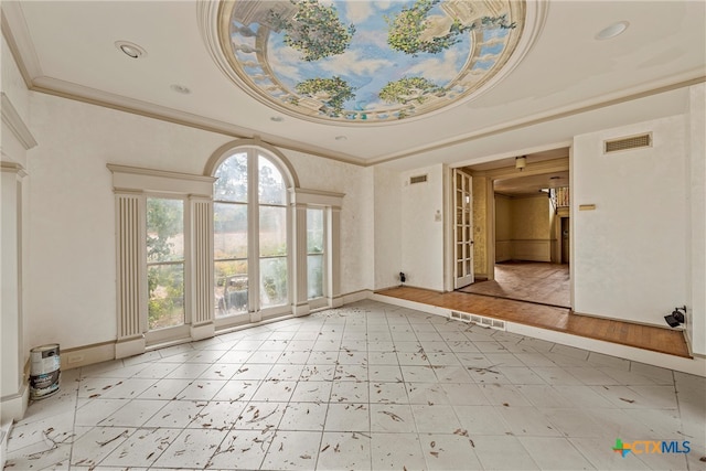 foyer entrance featuring crown molding