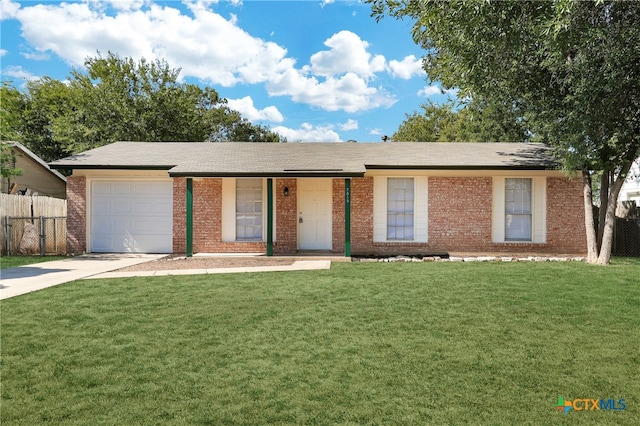 ranch-style home with a garage and a front yard