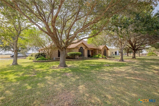 single story home featuring a front yard