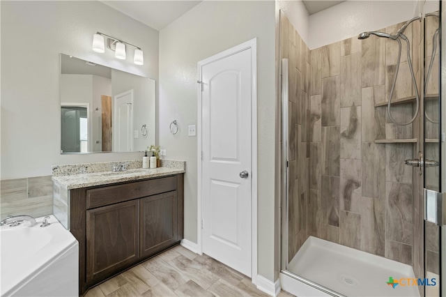 bathroom with vanity and plus walk in shower