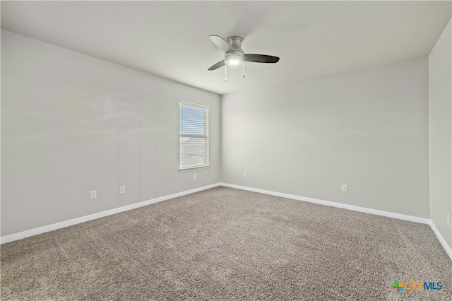 empty room featuring carpet flooring and ceiling fan