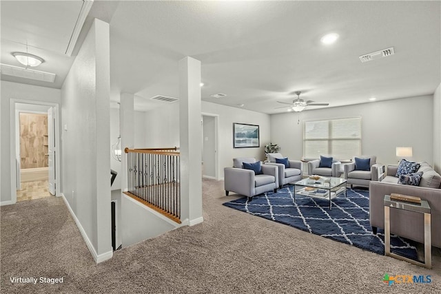 living room with ceiling fan and carpet floors