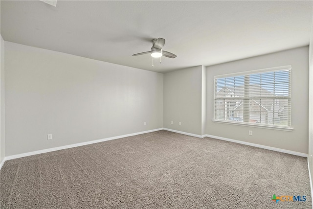 carpeted empty room with ceiling fan