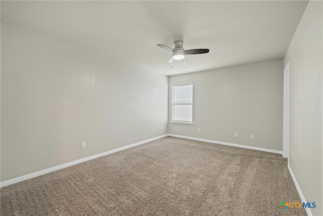 spare room featuring carpet floors and ceiling fan