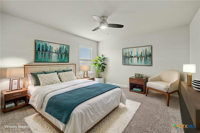 bedroom featuring ceiling fan and light carpet