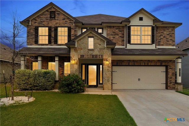 craftsman-style home with a yard and a garage