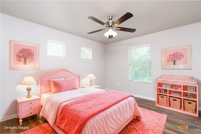 bedroom with ceiling fan and dark hardwood / wood-style flooring