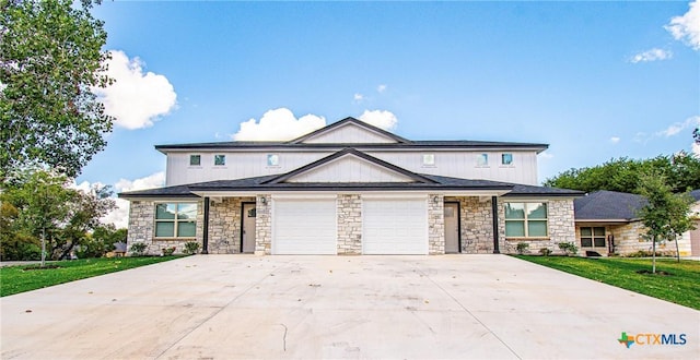 view of front of home featuring a garage and a front lawn