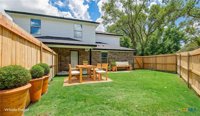 back of house with a yard, a patio, and an outdoor hangout area