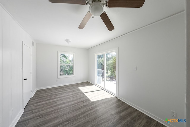 unfurnished room featuring ceiling fan and dark hardwood / wood-style floors