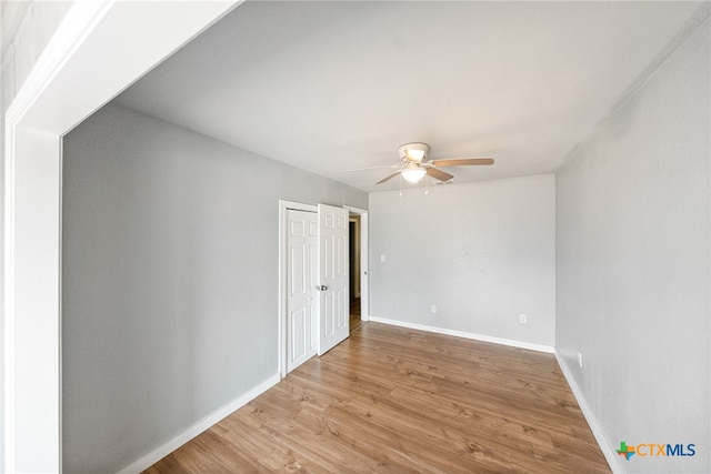 unfurnished room featuring ceiling fan and light hardwood / wood-style flooring