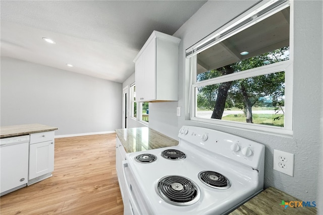 kitchen featuring white cabinetry, white appliances, and light hardwood / wood-style flooring