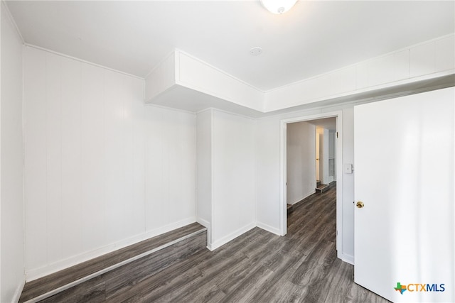 spare room featuring dark hardwood / wood-style flooring