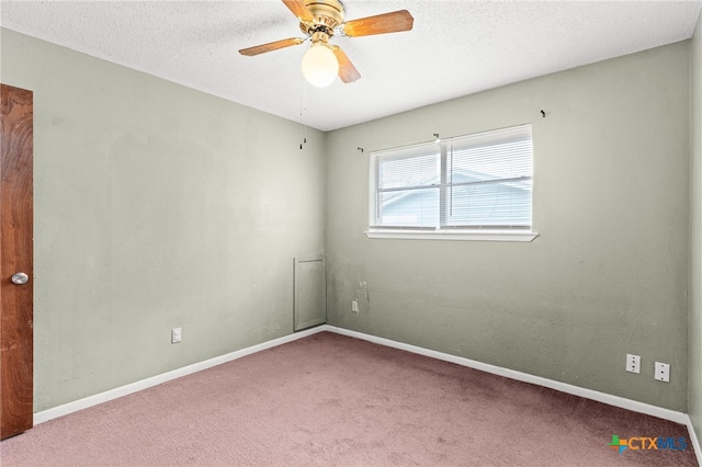 empty room with baseboards, carpet, a textured ceiling, and ceiling fan