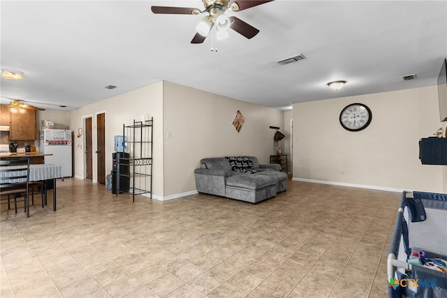 living room with ceiling fan